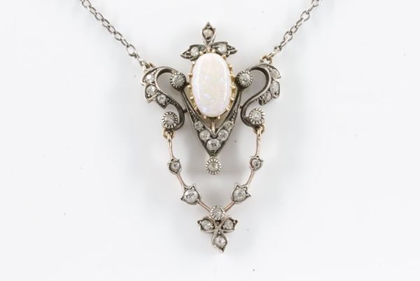 A LATE 19TH CENTURY OPAL AND DIAMOND PENDANT AND CHAIN