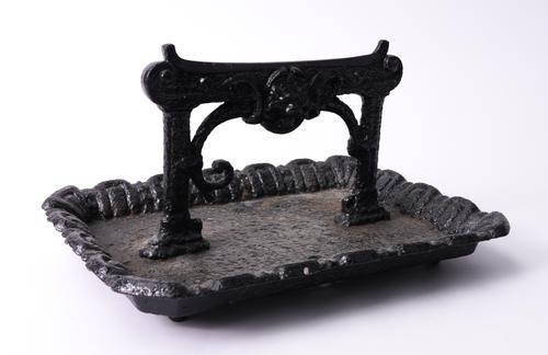 A PAINTED CAST IRON BOOT SCRAPER