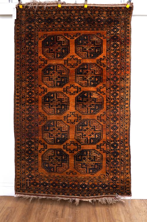 A GOLDEN AFGHAN RUG