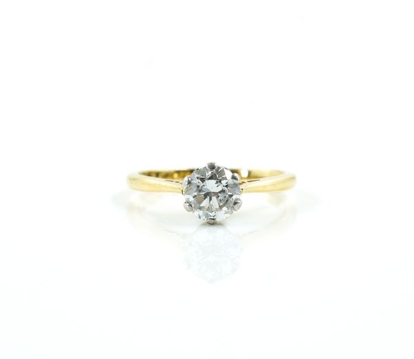 A GOLD, PLATINUM AND DIAMOND SINGLE STONE RING