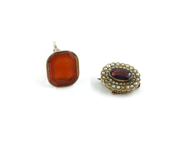 A 9CT GOLD, GARNET AND SEED PEARL OVAL BROOCH AND A CORNELIAN FOB SEAL (2)