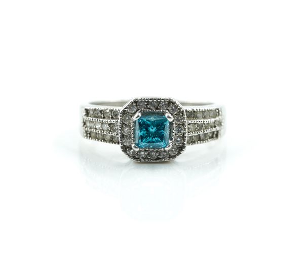 A WHITE GOLD, TREATED BLUE DIAMOND AND DIAMOND RING