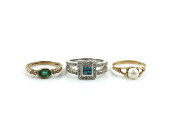 A TREATED BLUE DIAMOND AND DIAMOND RING AND TWO 9CT GOLD AND GEM SET RINGS (3)