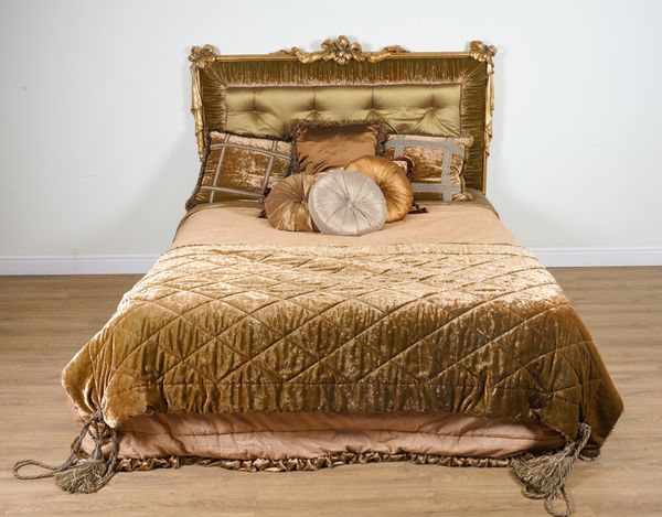 PROVASI: A SUPER KING SIZE BED WITH GILT FRAME RIBBON TIED UPHOLSTERED HEADBOARD