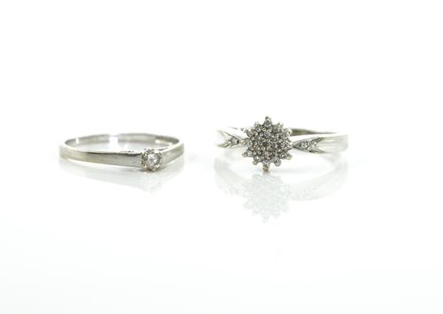 TWO 9CT WHITE GOLD AND DIAMOND RINGS (2)