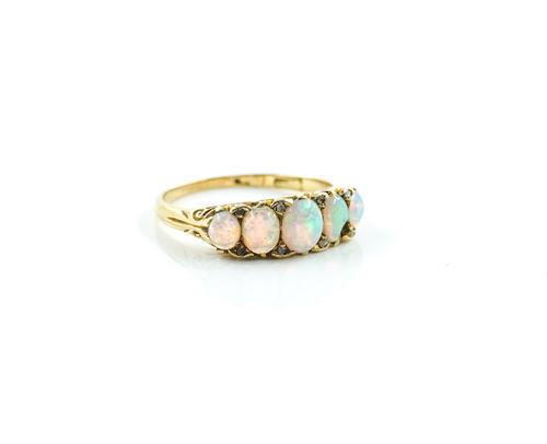 A GOLD AND OPAL FIVE STONE RING