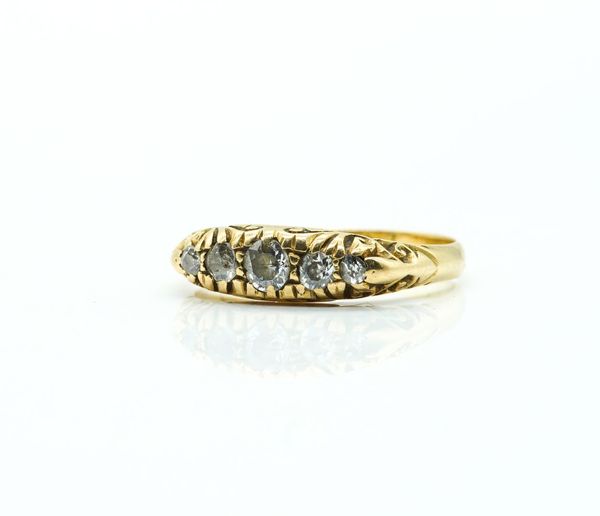A GOLD AND DIAMOND FIVE STONE RING