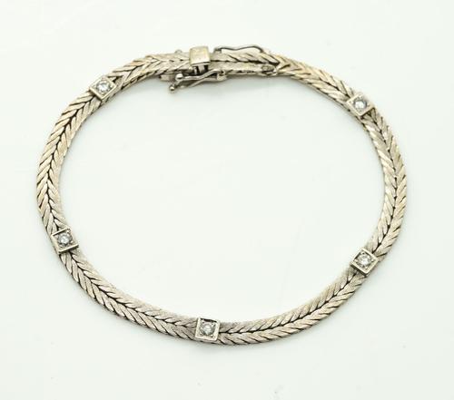A SWEDISH WHITE GOLD AND DIAMOND BRACELET