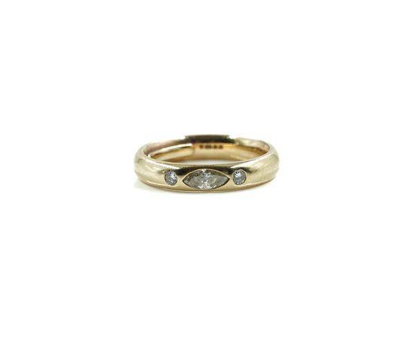 A 9CT GOLD AND DIAMOND THREE STONE RING