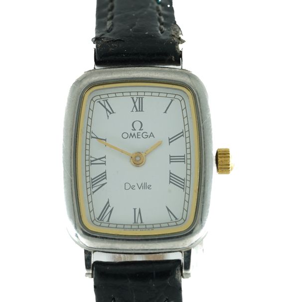 AN OMEGA DE VILLE QUARTZ STEEL CURVED RECTANGULAR CASED LADY'S WRISTWATCH