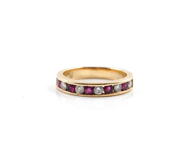 A GOLD, RUBY AND DIAMOND ELEVEN STONE HALF HOOP ETERNITY RING