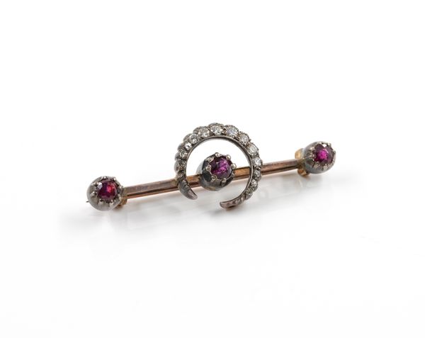 A GOLD BACKED AND SILVER SET VICTORIAN STYLE RUBY AND DIAMOND BROOCH