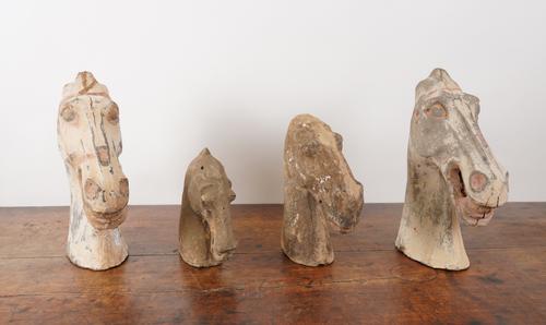 TWO POTTERY HAN DYNASTY STYLE HORSES’ HEADS (4)