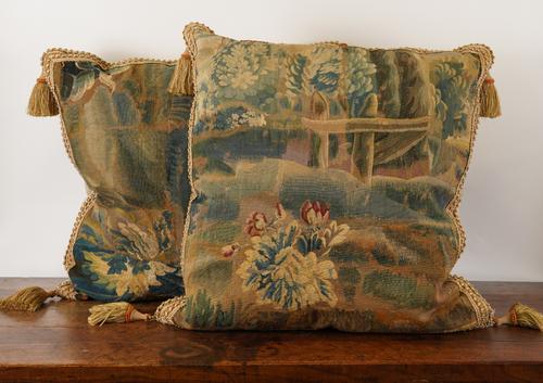 A PAIR OF FLEMISH VERDURE TAPESTRY FRAGMENT CUSHIONS (2)
