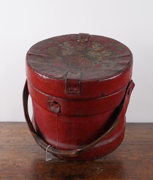A RED PAINTED CANVAS SHOT CORDITE CARRIER WITH ROYAL COAT-OF-ARMS