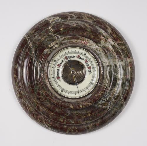 A CORNISH SERPENTINE MARBLE MOUNTED ANEROID BAROMETER
