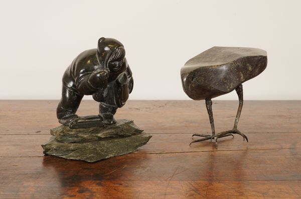 AN INUIT SOAPSTONE SCULPTURE OF A FISHERMAN AND ANOTHER SCULPTURE OF A BIRD (2)