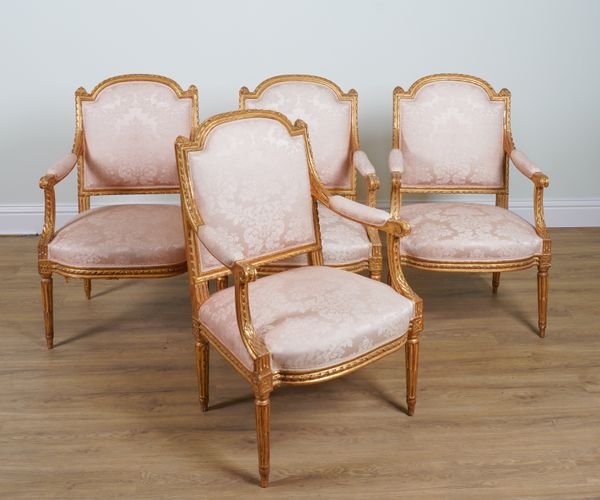 A SET OF FOUR LOUIS XVI STYLE GILT FRAMED OPEN ARMCHAIRS (4)