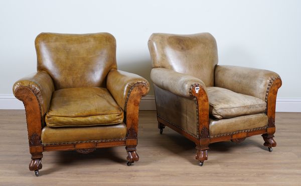 A PAIR OF MID 20TH CENTURY GREEN LEATHER UPHOLSTERED WALNUT FRAMED EASY ARMCHAIRS