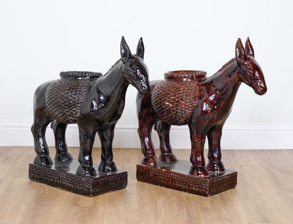 A PAIR OF GLAZED JARDINIERES MODELLED AS MULES (2)