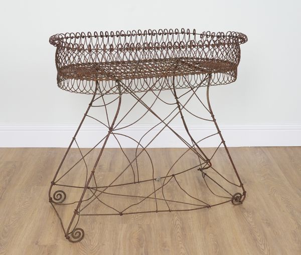 AN EDWARDIAN WIREWORK PLANT STAND