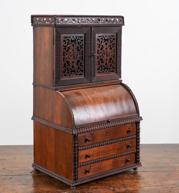 A LATE 19TH / EARLY 20TH CENTURY CONTINENTAL ROSEWOOD MINIATURE CYLINDER BUREAU CABINET WITH FRET CUT DOORS