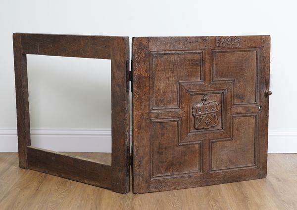 A 17TH CENTURY OAK PANELLED CUPBOARD DOOR