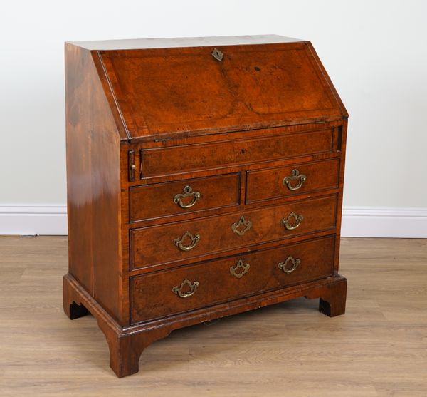 A GEORGE II FIGURED WALNUT BUREAU