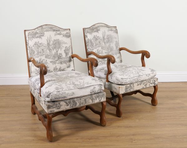 A PAIR OF FRENCH OAK FRAMED OPEN ARMCHAIRS (2)