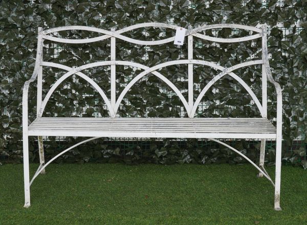 A REGENCY STYLE WHITE PAINTED STRAP METAL GARDEN BENCH