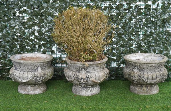 A SET OF THREE RECONSTITUTED STONE JARDINIERES (3)