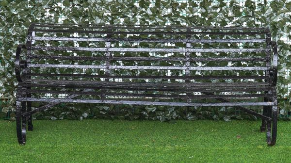 A 19TH CENTURY BLACK PAINTED STRAP IRON GARDEN BENCH