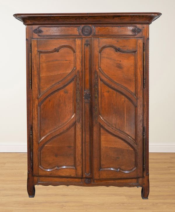 AN 18TH CENTURY FRENCH OAK TWO DOOR ARMOIRE