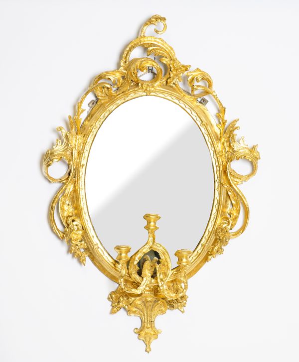 A 19TH CENTURY LATER GILDED OVAL GIRANDOLE MIRROR