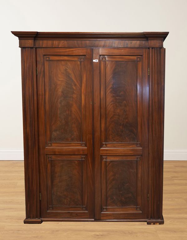 A REGENCY MAHOGANY TWO DOOR WARDROBE