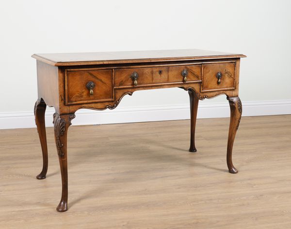 A GEORGE I STYLE WALNUT THREE DRAWER SIDE TABLE