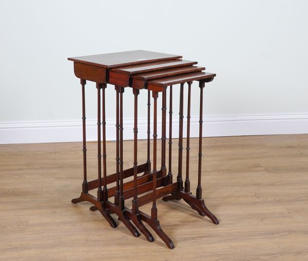 AN EDWARDIAN INLAID MAHOGANY NEST OF FOUR TABLES