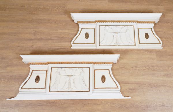 A PAIR OF REGENCY STYLE PARCEL GILT AND WHITE PAINTED DOOR PORTICOS (2)