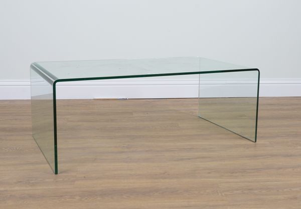 A MODERN GLASS SINGLE MOULDED COFFEE TABLE