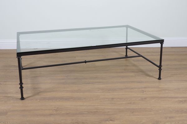 A MODERN GLASS TOPPED RECTANGULAR COFFEE TABLE