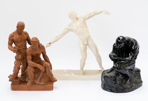 A TERRACOTTA COLOURED PLASTER GROUP OF TWO QUARRY MEN (3)