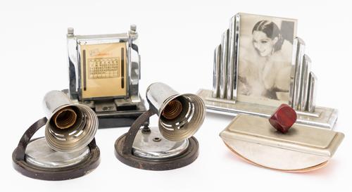 AN ART DECO CHROME PLATED PHOTOGRAPH FRAME, A PERPETUAL DESK CALENDAR AND A PAIR OF WALL LIGHTS (5)