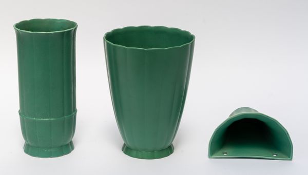 KEITH MURRAY FOR WEDGWOOD: TWO MATT GREEN GLAZED VASES AND A WALL POCKET (3)