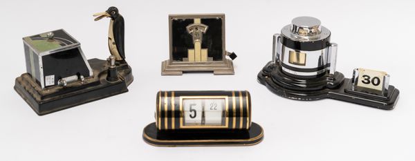 AN ART DECO CHROME PLATED AND BLACK ENAMEL ‘ODEON’ BAROMETER AND TWO PERPETUAL CALENDARS (4)