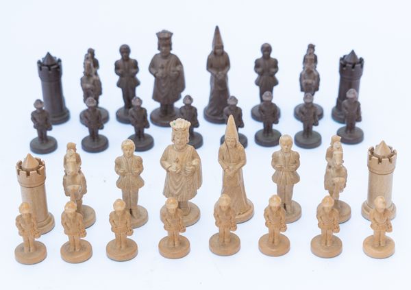 AN ITALIAN ANRI CARVED WOOD FIGURAL CHESS SET (32)