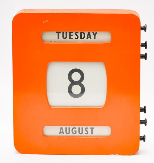 AN ORANGE PAINTED PERPETUAL CALENDAR