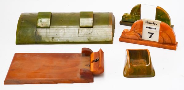 FOUR ART DECO CARVACRAFT AMBER AND GREEN BAKELITE DESK ACCESSORIES AND AN INKSTAND (5)