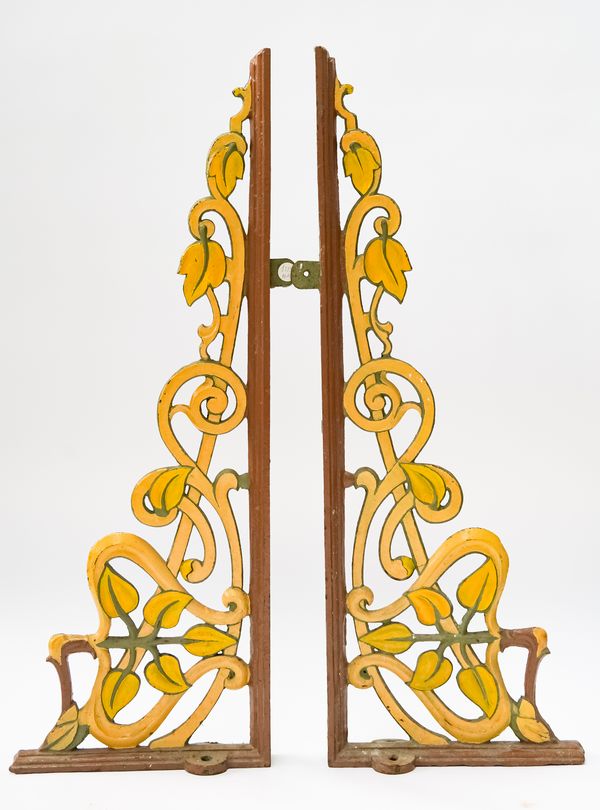 A PAIR OF PAINTED CAST AND WROUGHT IRON WALL BRACKETS (3)