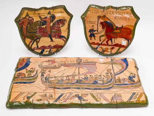 LOUIS ETIENNE DESMANT (FRENCH 1844-1902): A RECTANGULAR POTTERY PANEL AND A PAIR OF SHIELD SHAPED PANELS (3)