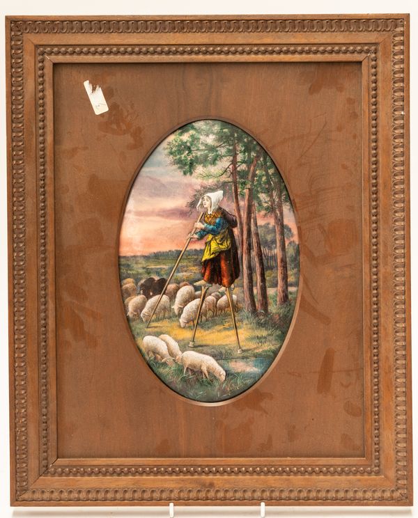 JULES SARLANDIE, LIMOGES: A FRENCH ENAMEL PLAQUE DEPICTING A SHEPHERDESS ON STILTS OVERLOOKING SHEEP